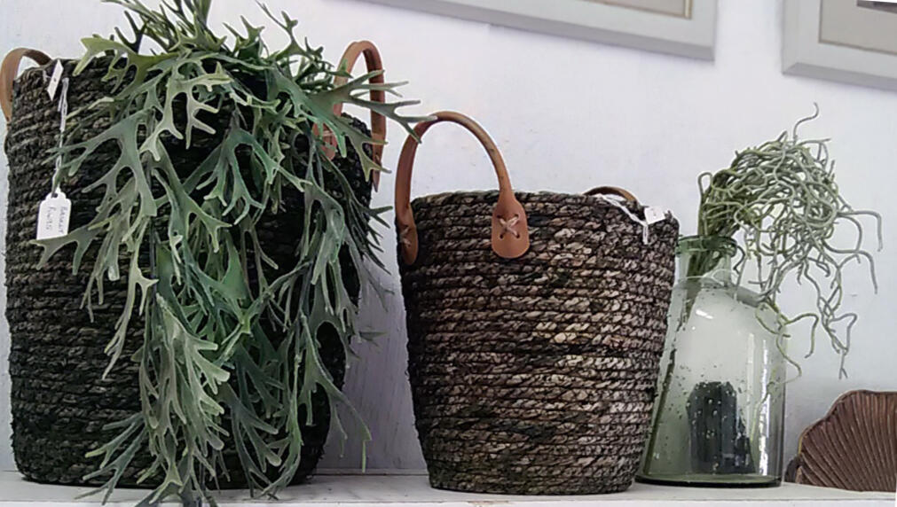 Woven baskets and glass jar